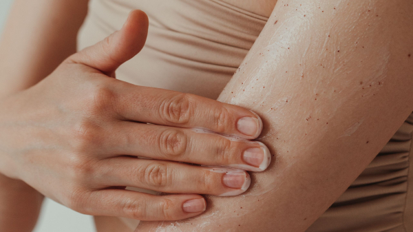 applying cream to arm